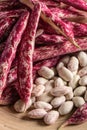 Vertical closeup shot of fresh borlotti beans and pods