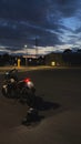 Vertical closeup shot of a KTM duke 125 parked during night