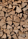 Vertical closeup shot of a pile of firewood preparation for winter Royalty Free Stock Photo