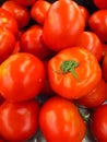 Vertical closeup shot of a pile of red tomatoes Royalty Free Stock Photo