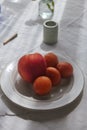 Vertical closeup shot of a plate with fruits on a table Royalty Free Stock Photo