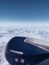 Vertical closeup shot of a propeller of an airplane above the clouds Royalty Free Stock Photo