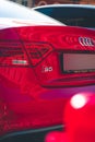 Vertical closeup shot of the rear of a red Audi S5 car