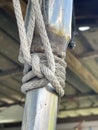 vertical closeup shot of a rope on a ship bridge Royalty Free Stock Photo