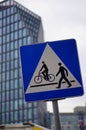Vertical closeup shot of a square road sign indicating the passage for pedestrians and cyclists
