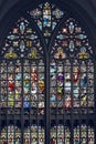 Vertical closeup shot of stained glass windows of an old church