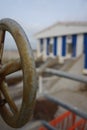 Vertical closeup shot of a steel valve with a blurred background