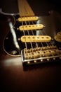 Vertical closeup shot of the strings of an electric guitar Royalty Free Stock Photo