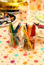 Vertical closeup shot of two jars with colorful crayons Royalty Free Stock Photo