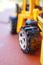 Vertical closeup shot of the wheel of a toy car Royalty Free Stock Photo