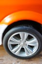 Vertical closeup shot of the wheel of a toy car Royalty Free Stock Photo