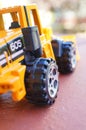 Vertical closeup shot of the wheel of a toy car Royalty Free Stock Photo