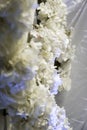 Vertical closeup shot of white artificial flowers used as wedding decorations Royalty Free Stock Photo