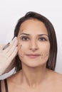 Vertical closeup shot of a woman preparing her face for a plastic surgery  procedure  professional Royalty Free Stock Photo