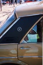 Vertical closeup side shot of back door of an old Austin Victoria De Luxe in cream color