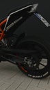 Vertical closeup side view of KTM Duke 125 motorcycle in dark themes