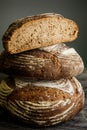 Vertical closeup three pieces of handmade round brown rye bread