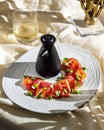 Vertical closeup of tuna sashimi with ponzu sauce and a glass of alcoholic drink Royalty Free Stock Photo