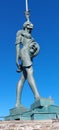 Vertical closeup of the Verity sculpture at Ilfracombe harbour, Devon with a beautiful blue sky