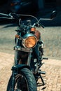 Vertical closeup of a vintage motorbike captured in the streets of Lisbon, Portugal