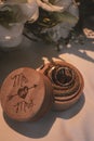 Vertical closeup of wedding bands in an adorable wooden box Royalty Free Stock Photo