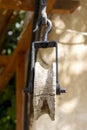 Vertical closeup wooden pulley with a rustic hook on top Royalty Free Stock Photo