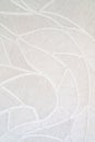 Vertical closeup of a woven white fabric background