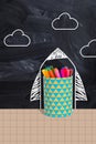Vertical collage illustration of colorful pens cup drawing rocket clouds blackboard isolated on painted background Royalty Free Stock Photo
