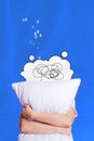 Vertical collage image of headless sleeping person arms hold white pillow isolated on blue background