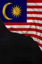 Vertical colored national flag of the modern state of Malaysia, beautiful silk, black blank, concept of tourism, economy, politics