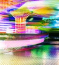 Vertical colorful long-exposure shot of the 'Twister' ride - fun fair