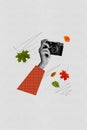 Vertical composite concept photo collage of hand hold vintage camera shooting beauty of autumn season isolated on gray Royalty Free Stock Photo