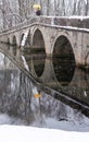 Vertical Composition of Stone Bridge Reflection in Still Water Royalty Free Stock Photo