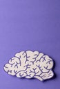 Vertical composition of white and purple brain on purple background with copy space