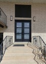 Vertical Concrete doorstep with railings of a modern traditional house