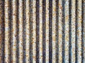 Vertical concrete texture with exposed stone aggregate and repeating rough surface pattern Royalty Free Stock Photo