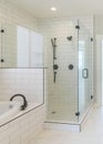 Vertical Contemporary master bathroom interior with marble tile flooring and a view of a room