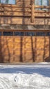 Vertical crop Facade of a luxury wooden home in Park City Utah with snowy driveway in winter Royalty Free Stock Photo