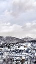 Vertical crop Houses that sit on a mountain in Park City with evergreens and snow in winter Royalty Free Stock Photo