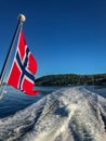 Vertical Crop Norwegian Flag Sailing From Back of Ferry in Oslo Fjord