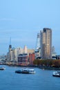 Vertical crop portrait of the River Thames in London at evening showing boats in the foreground and the oxo building and