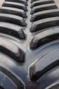 Vertical cropped photo of black used rubber caterpillar of construction auto equipment Royalty Free Stock Photo