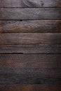 Vertical dark wooden planks background top view