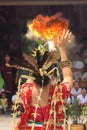 Vertical of a Dayak woman fire dance, Kalimantan, Indonesia during traditional medicine ceremonies