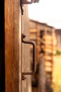 Vertical detailed view of an old wooden door's handle