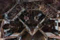 vertical downward view of the walls of an abandoned and destroyed building, the smooth geometry of architecture as