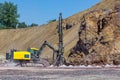 The Vertical drilling rig machine in stone quarry. Royalty Free Stock Photo