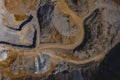 Vertical drone panorama of open mine or quarry on a sunny day at Verd, Slovenia. Visible terraces and vast surface of sand and Royalty Free Stock Photo