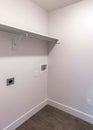 Vertical Empty laundry room of a house with white wall interior Royalty Free Stock Photo