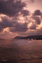 Vertical Epic: Red Twilight, Massive Clouds, and Sunset Waves